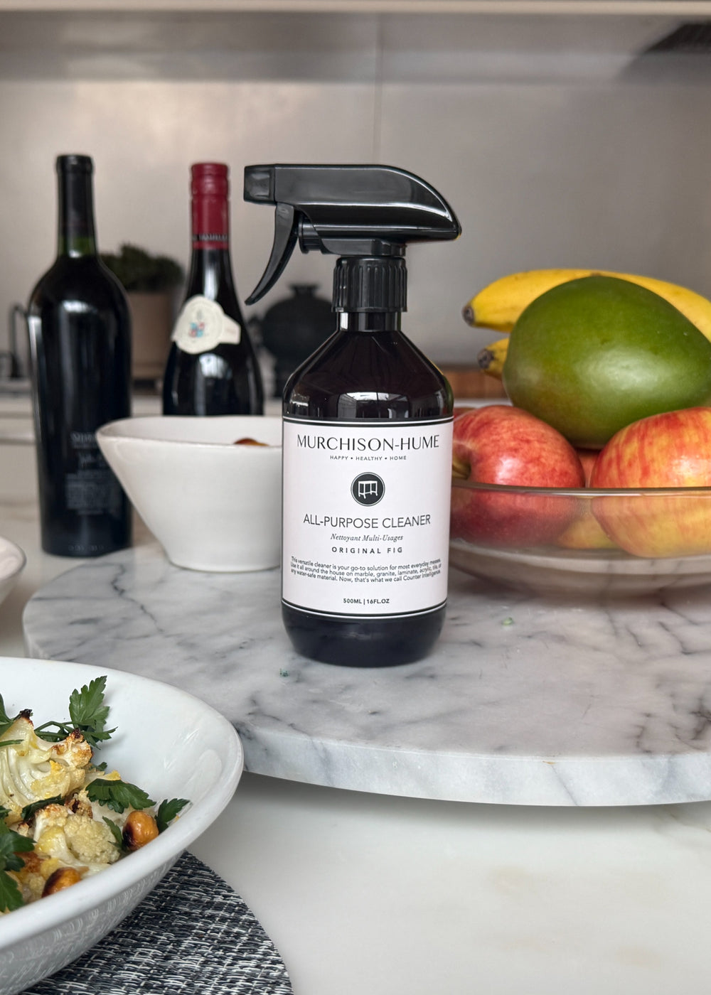 All-Purpose Cleaner in Original Fig fragrance with amber bottle on neutral surface